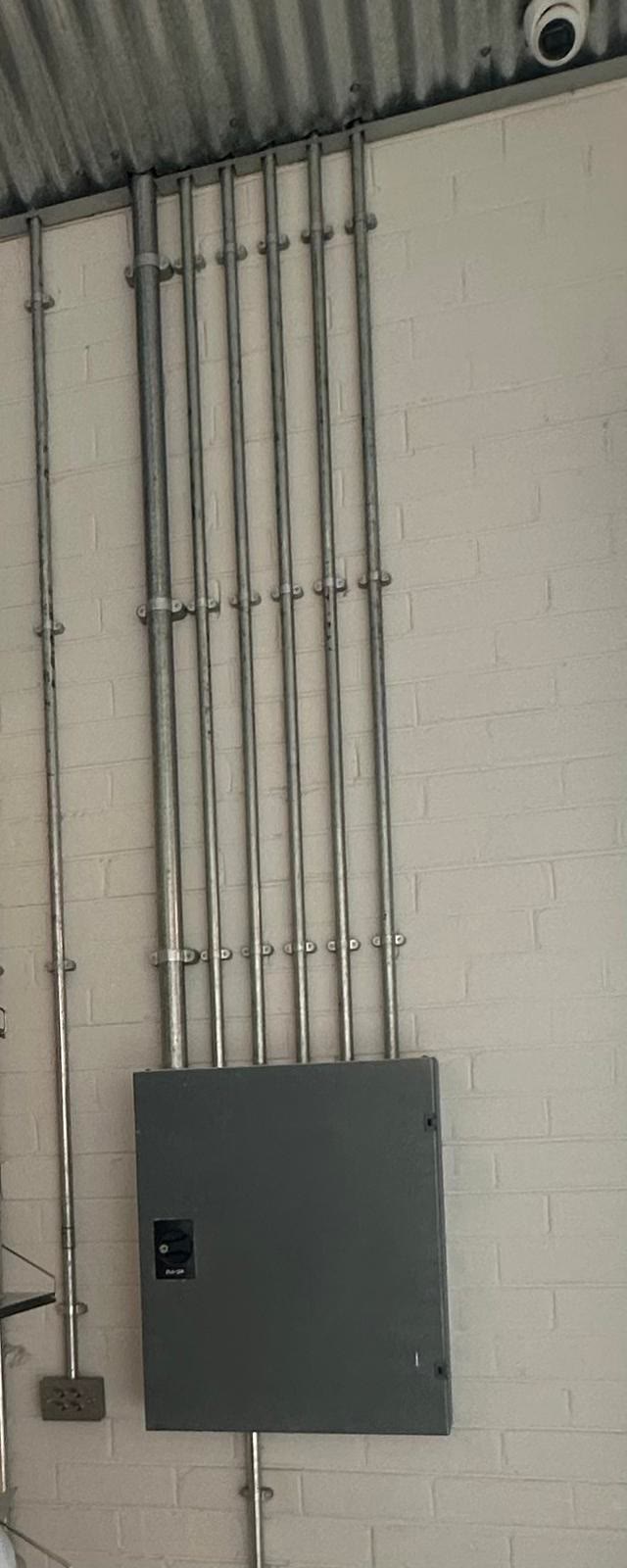 Electrical conduit run along a wall
