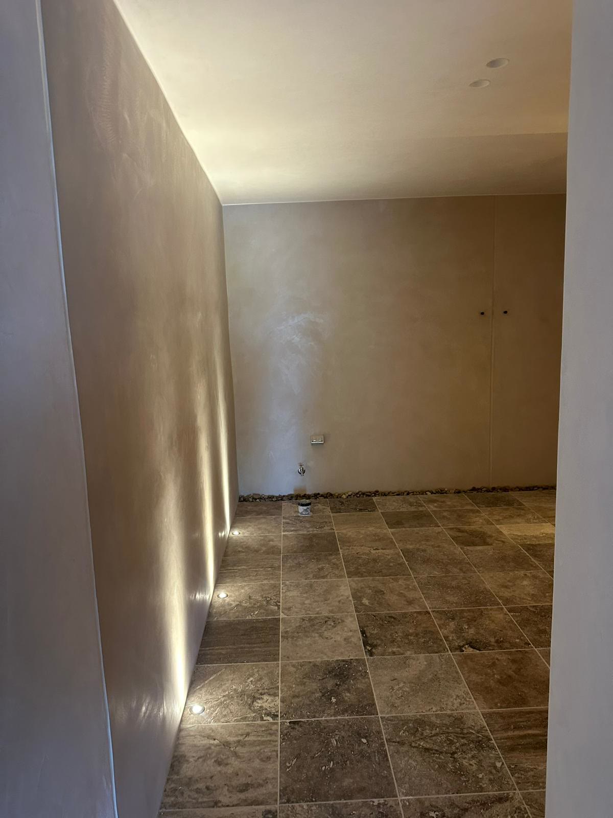 Hallway with LED strip lighting and downlights