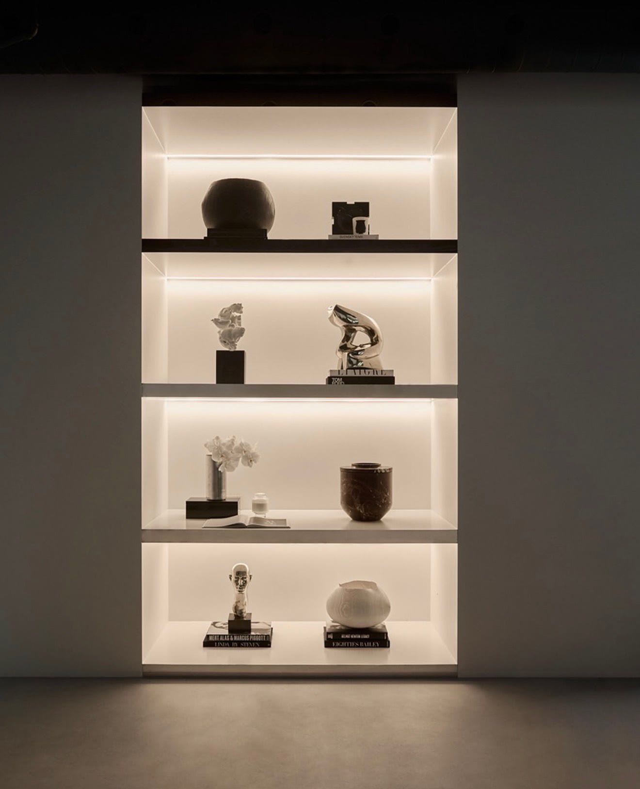 Backlit display shelving with concealed LED strip lighting
