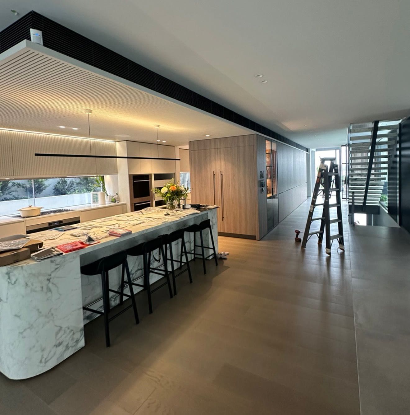 Kitchen fit-out in progress with marble island