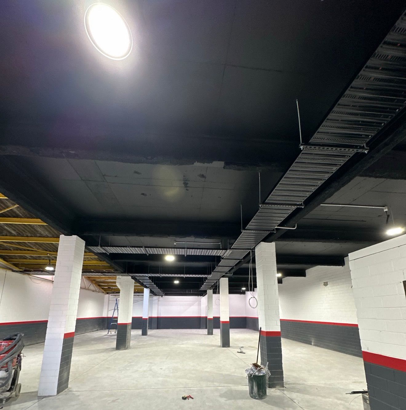 Basement carpark with conduit and lighting rough-in
