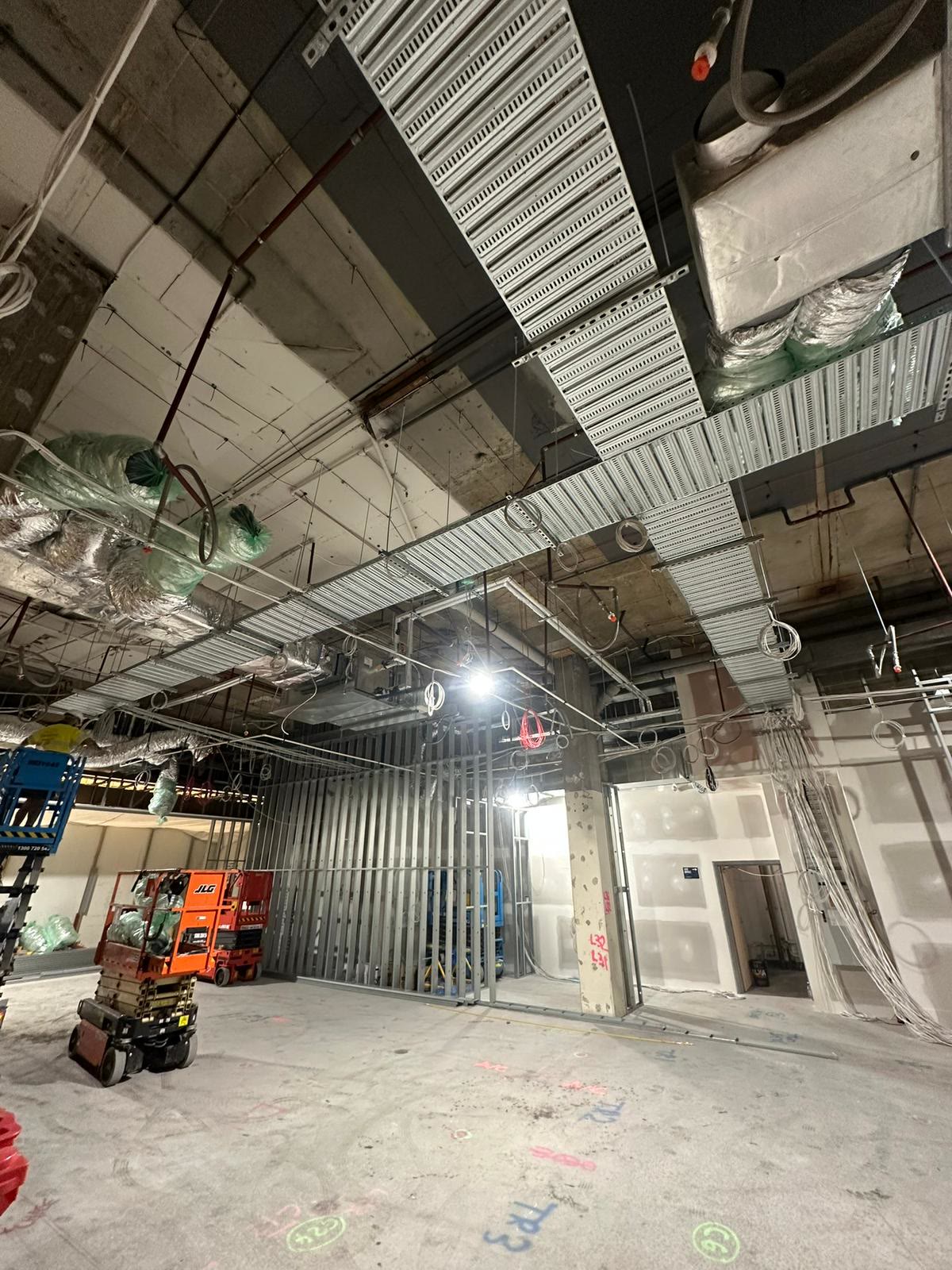 Commercial ceiling rough-in with conduit, cabling and services on a fit-out
