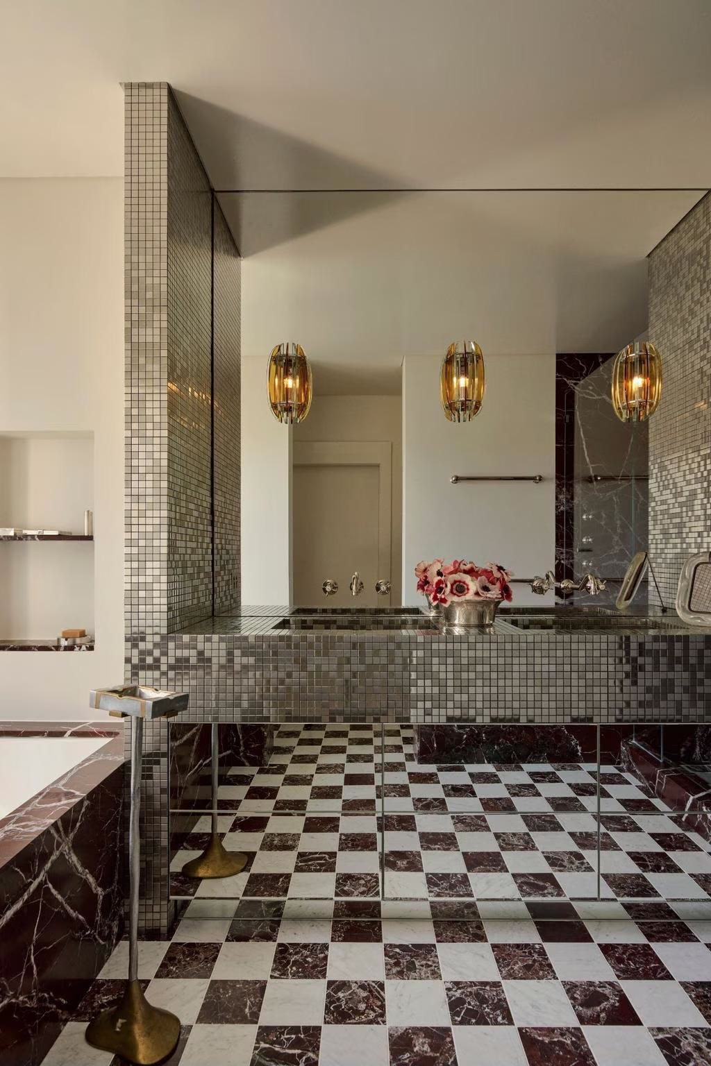 Bathroom with pendant lighting and marble finishes